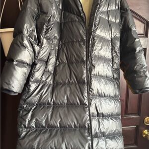 Elegant Black Puffer Jacket for Women by NIKE.